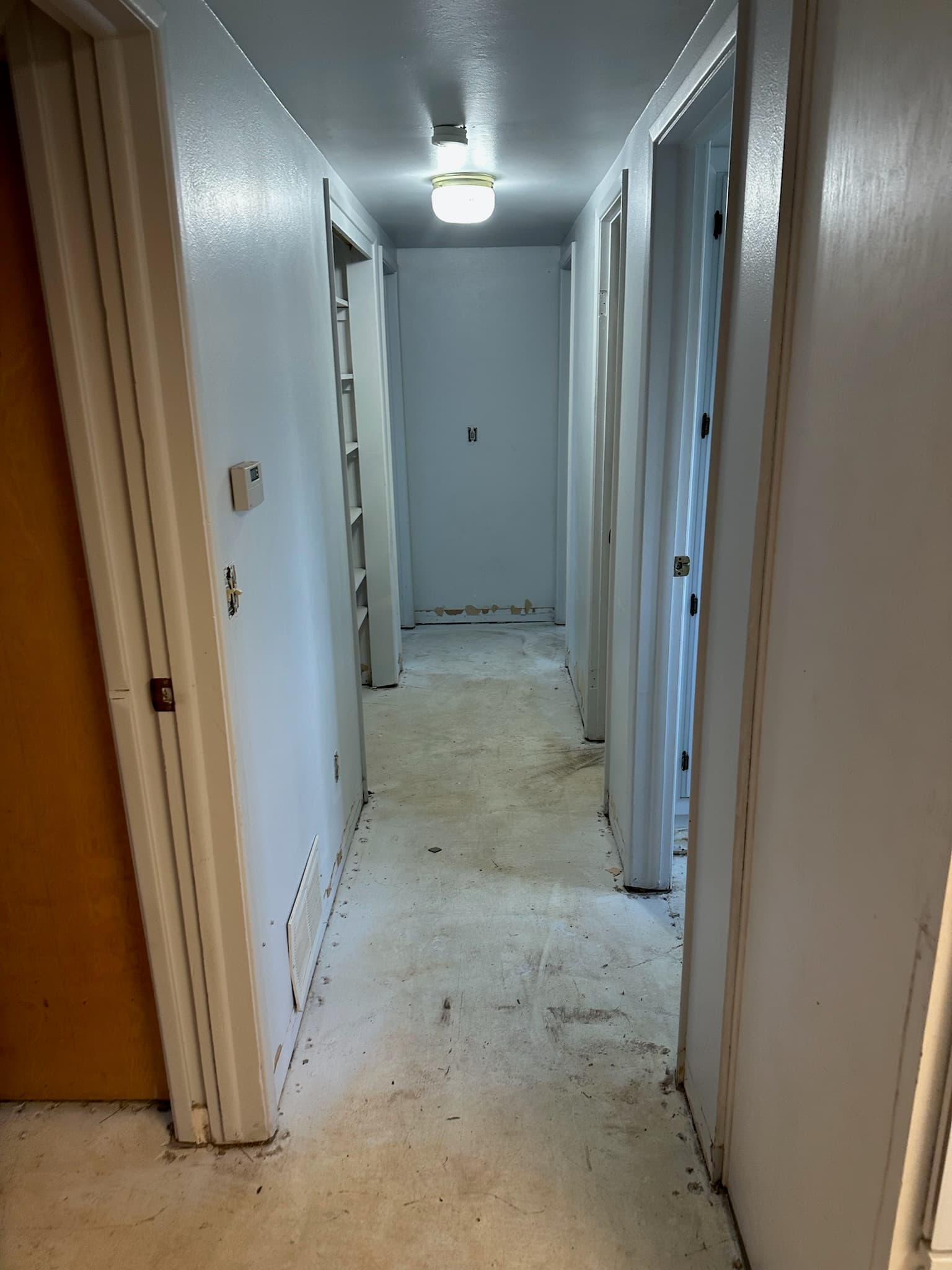 Hallway demolished to subfloor